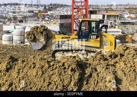 Baustelle des Quartiers Boeckinger Straße in Zuffenhausen mit Planierraupe. Insgesamt sind es rund 460 neue Wohnungen für verschiedene Benutzergruppen Stockfoto