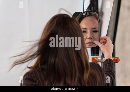 United States Secretary of Agriculture Brooke Rollins checks her reflection in a mirror as she participates in a media interview outside the West Wing of the White House in Washington, DC, on Friday, March 13, 2026.  Credit: CNP / AdMedia Stockfoto