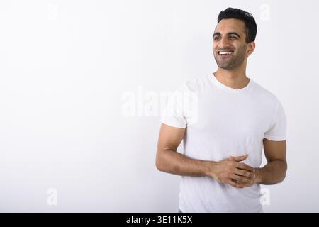 Studio shot der jungen schönen Indischen Menschen gegen den weißen Hintergrund Stockfoto