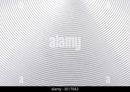 Oberfläche aus gebürstetem Aluminium mit kreisförmigem Muster und metallischem Glanz Stockfoto