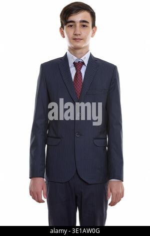 Studio-Aufnahme des jungen hübschen persischen Teenager-Geschäftsmann stehend Stockfoto