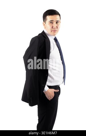 Geschäftsmann, der wegschaut, während er eine Jacke hält Stockfoto