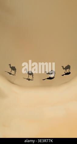 Aus der Vogelperspektive ziehen Kamelschatten über den hügeligen goldenen Sand, eine zeitlose Wüstenszene, Dubai, Vereinigte Arabische Emirate. Stockfoto