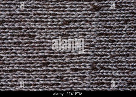 Dunkle Alpakawolle gestrickt Textil Makrostruktur Naturfaser Hintergrund Stockfoto