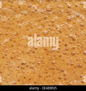 Quadratischer Kaffeeschaum Textur Hintergrund Crema Makro Nahaufnahme abstrakte Oberfläche Stockfoto