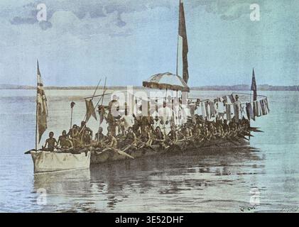 Friedrich Wilhelm Koko Mingi VIII. Von Nembe (1853–1898), bekannt als König Koko und König William Koko. Afrikanischer Herrscher des Nembe-Königreichs (auch bekannt als Nembe-Brass) im Nigerdelta, heute Teil des südlichen Nigerias. König Koko Mingi VIII. Kriegskanu auf dem Brass River. Gefangengenommene feindliche Flaggen, die das Deck schmücken. Foto von André & Sleigh. Farbig. Stockfoto