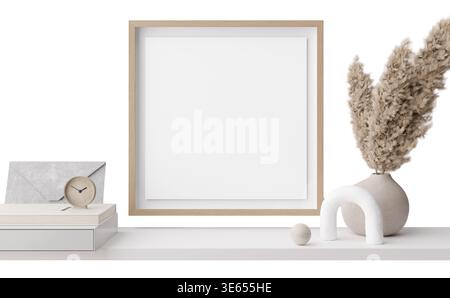 In einem Regal sind verschiedene Dekorationsgegenstände ausgestellt, darunter ein leerer Rahmen, eine Uhr, eine Vase mit getrockneten Blumen und minimalistische Formen. Diese Einrichtung ist für gedacht Stockfoto