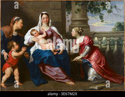 Ein Ölgemälde mit dem Titel Sacra Conversazione des flämischen Künstlers Gerard Seghers, das zwischen 1611 und 1651 ausgeführt wurde. Die Komposition zeigt die Jungfrau Maria mit dem Christkind, flankiert von der Heiligen Elisabeth und dem Säugling Johannes dem Täufer auf der linken Seite und der Heiligen Katharina von Alexandria auf der rechten Seite. Die Heilige Katharina wird durch ihre Attribute eines Palmenzweigs und eines brechenden Rades identifiziert. Stockfoto