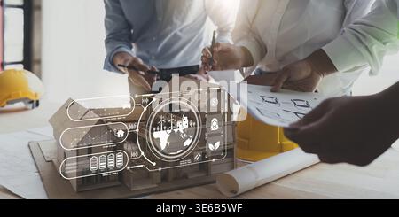 Architekten, die mit Bauplänen arbeiten. Bauingenieurteams, die zusammenarbeiten. Teamarbeit von Projektmanagern in der Foreman Industry Stockfoto