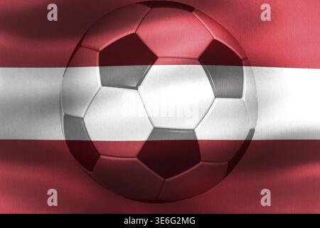 Österreich-Flagge mit einem Fußball, der sich im Wind bewegt Stockfoto