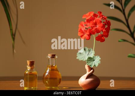 Geranienätherisches Öl in Glasflaschen. Stockfoto