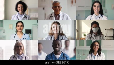 Senioren- und junge Ärzte verschiedener Rassen posieren im Krankenhaus Stockfoto