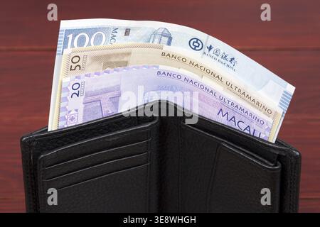 Macanese Money - Pataca in der schwarzen Brieftasche Stockfoto