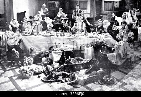 Das Bild zeigt eine Bankettszene aus Jacques Feyders Film *Kermesse Eroica* aus dem Jahr 1935, produziert von Tobis in Paris und Berlin. Der Film zeigt eine historische Erzählung, und die Bankettszene ist Teil des Sets. Stockfoto