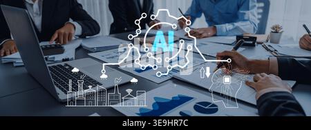 Geschäftsteam arbeitet an der Strategieplanung für künstliche Intelligenz in moderner Büroumgebung mit Laptops und Charts Quark zusammen. Stockfoto