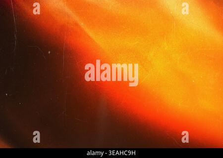 Warmes Orange und gelbes Vintage-Folienüberzug mit starker Körnung Stockfoto