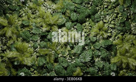 Dichte Schichten grüner Blätter füllen den Boden in einer Waldlandschaft. Verschiedene Arten von Pflanzen und Farnen schaffen eine natürliche, lebendige Szene bei Tageslicht. Stockfoto