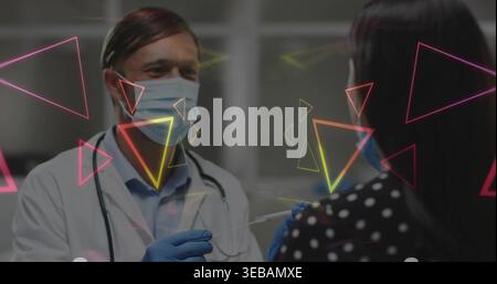 Vorbereitung der Dr-Weißmantel-Haltespritze bei klinisch maskierten Polka-Top-Patienten mit Armhandschuhen Neon Stockfoto