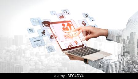 Innovative digitale Lernkonzepte mit interaktiver Laptop-Schnittstelle, die die Entwicklung von Fähigkeiten und das Bildungswachstum im modernen Umfeld veranschaulichen Stockfoto