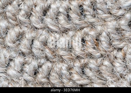 Häkeln mit Juteseile, geknüpft, rundes Halbkreismuster, Oberflächenmakro Stockfoto