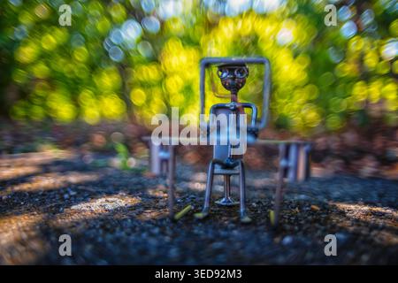 Figur einer Person an einem Computerprogrammierer-Symbol Stockfoto