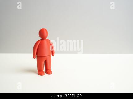 Eine rote menschliche Figur und ein leerer Hintergrund. Eine Person und eine Figur, ein Diashow-Hintergrund. Minimalismus, Konzeptualismus und abstrakte Präsentation templ Stockfoto