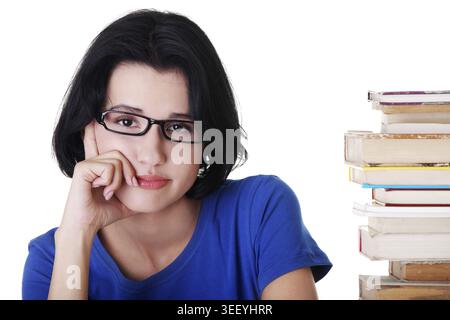 Traurige Schülerin mit Lernschwierigkeiten, isoliert auf weiß Stockfoto