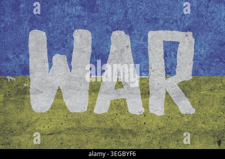 Inschrift an der Kriegswand in den Farben des ukrainischen Flaggenhintergrunds blau und gelb Stockfoto