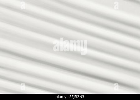Abstraktes Muster aus Licht und Schatten auf weißem Stoff für eine wellige Textur Stockfoto