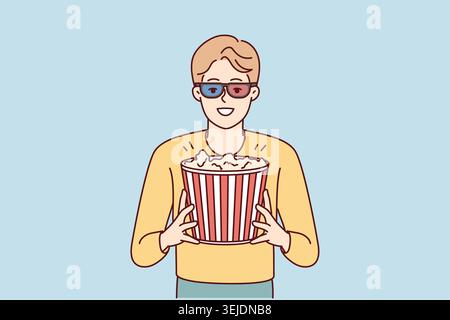 Glücklicher Mann mit Popcorn im Kino Stockfoto