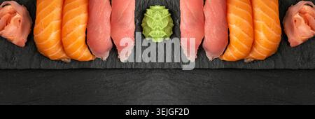 Makrofoto von Lachs Nigiri Sushi und Maguro Thunfisch susi Set. Susi Set Brötchen mit rohen roten Fischen auf dunklem Steinteller aus nächster Nähe Stockfoto