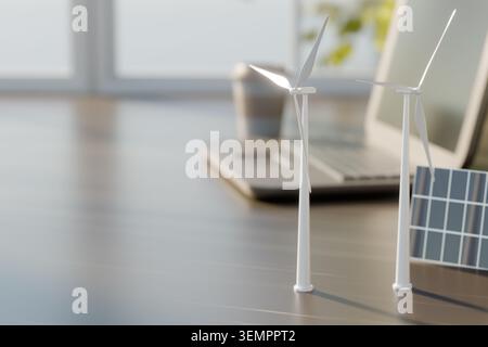 3D-Rendering von Windkraftanlagen- und Solarmodellen auf einem Tisch mit verschwommenem Laptop und Kaffeetasse. Konzept der Erneuerbaren Energietechnik, Green Techn Stockfoto
