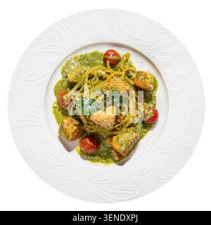 Pesto-Pasta mit Lachs und Kirschtomaten Stockfoto
