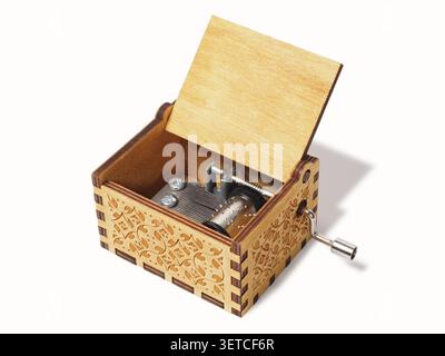 Kleine Spieluhr mit auf weißem Hintergrund Kurbel Stockfoto