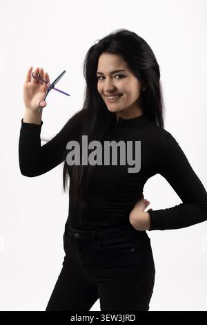 Schöne junge Frau während der Fotoshooting-Sitzung isoliert Stockfoto