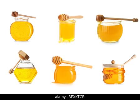 Verschiedene Gläser Honig mit hölzernen Honiglöffeln Stockfoto