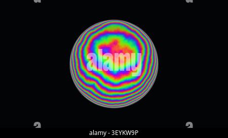 Die Szene zeigt eine kreisförmige Darstellung lebendiger Spiralmuster in verschiedenen Farben. Der kontrastierende dunkle Hintergrund unterstreicht das farbenfrohe Design. Stockfoto