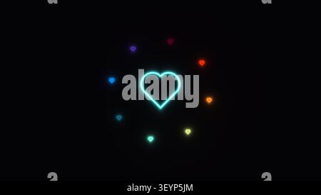 In der Mitte befindet sich ein leuchtendes Neonherz mit bunten Herzen, die auf schwarzem Hintergrund angeordnet sind. Die Lichter sorgen für einen lebendigen und auffälligen Blickfang Stockfoto