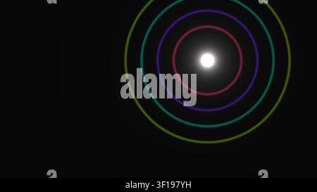 Farbenfrohe konzentrische Kreise, die von einem hellen Mittelpunkt gegen einen einfarbigen schwarzen Hintergrund ausstrahlen. Das Design veranschaulicht geometrische Formen in einem Minim Stockfoto