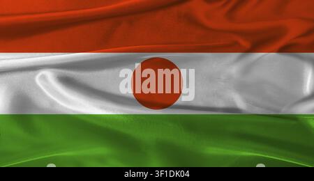 Flagge von Niger mit stoffartigem Hintergrund. Nahaufnahme der Nationalflagge von Niger mit realistischer Textur Stockfoto