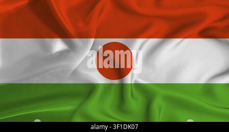 Realistische nigerianische Flagge, die weht. Nahaufnahme der Flagge von Niger mit Stofftextur Stockfoto