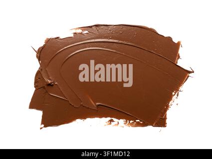 Schokoladenfleck isoliert, geschmolzene Schokoladenstruktur auf weißem Hintergrund, Schokoladensoßenmuster, Kakao-Haselnuss-Creme, flüssige Schokoladenpaste, Braun C Stockfoto