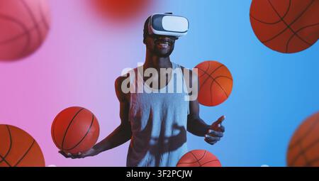 Afroamerikanischer Mann genießt ein Virtual-Reality-Basketballerlebnis mit Headset, Inneneinrichtung Stockfoto