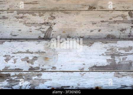 Hintergrundtextur von alten Holzbrettern mit abblätternder Farbe Stockfoto