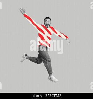 Glücklicher asiatischer Mann, der vor Freude in einem farbenfrohen Pullover springt, Inneneinrichtung Stockfoto