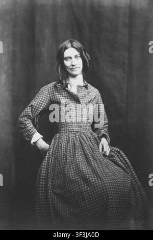 Eine nicht identifizierte Patientin sitzt auf einem Stuhl in dem Foto Patient, Surrey County Lunatic Asylum aus den 1850er Jahren von dem bahnbrechenden britischen Psychiater und Fotografen Dr. Hugh Welch Diamond (1808–1886). Diamond war der Leiter der Frauenabteilung im Asyl und nutzte Fotografie als objektives klinisches Werkzeug zur Diagnose. Diese historische Arbeit stellt eine der frühesten systematischen Anwendungen der fotografischen Physiognomie im Bereich der psychiatrischen Medizin dar. Stockfoto