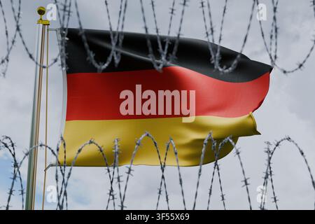 Deutsche Flagge, die an einer Flaggenmast weht, gesehen hinter scharfem Stacheldraht vor einem bewölkten Himmel. Konzeptbild, das europäische Einwanderungspolitik vertritt Stockfoto