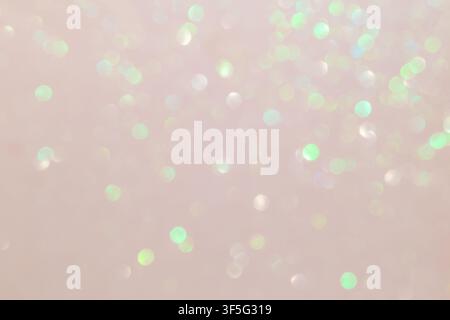 Weicher rosa Bokeh-Hintergrund mit mintgrünem Glitzern und zartem Pastellglanz Stockfoto
