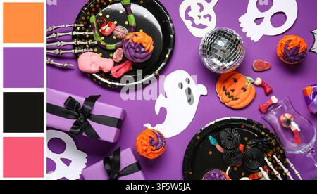 Halloween-Party-Dekorationen und Leckereien auf lila Hintergrund Stockfoto