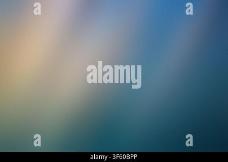 Ein raffiniertes abstraktes Hintergrundmotiv, das weiche blaue und warme goldene Töne mit einem feinen, gleichmäßigen Texturrfinish vermischt. Stockfoto